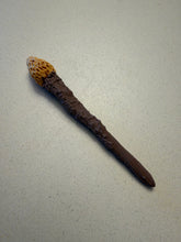 Load image into Gallery viewer, Frogman mini wand from the 2024 movie, showing the full brown textured shaft and mustard-yellow tip.

