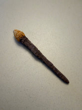 Load image into Gallery viewer, Reverse side of the Frogman movie mini wand, showing bark-like brown texture and the sculpted yellow head.
