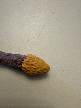 Load image into Gallery viewer, Angled detail of the sculpted mustard-yellow tip on the 3D-printed Frogman mini wand collectible.
